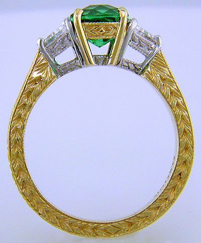 Side view of 18kt gold ring with tsavorite garnet and diamonds.