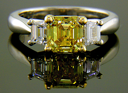 Vivid yellow emerald-cut diamond in a custom platinum ring.