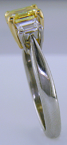 Side view of vivid yellow emerald-cut diamond ring.