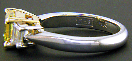Close up of Bijoux Extraordinaire hallmark, 'BEL', and the platinum metal mark, 'PLAT'.
