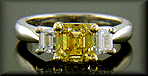 Vivid yellow emerald-cut diamond ring.