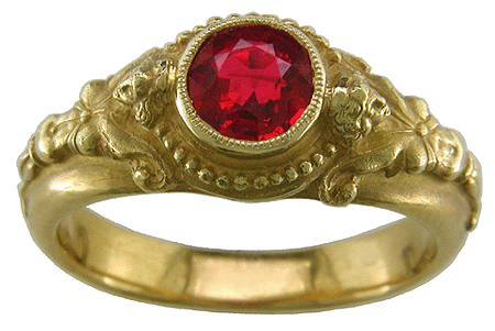 Classically inspired 18kt gold ring with a fiery red spinel.