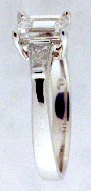 Side view of platinum diamond engagement ring.