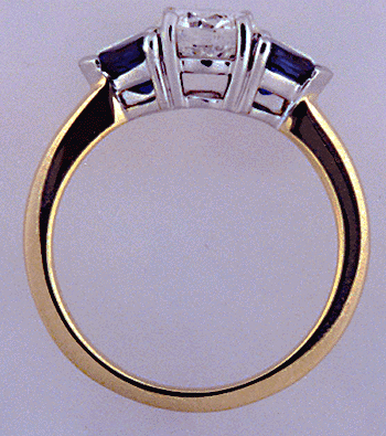 Platinum, yellow gold, diamond and sapphire ring side view.