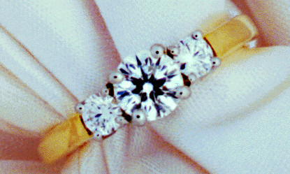 Ideal cut diamond engagement ring in platinum and yellow gold.