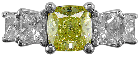 Fancy color yellow diamonds in handcrafted platinum ring.