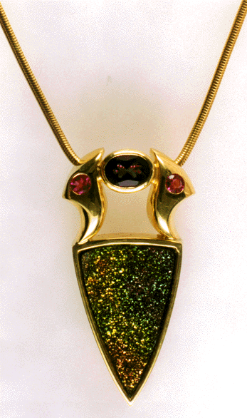 18kt gold pendant with iridescent pyrite with snake chain.