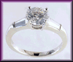 Platinum custom ring with tapered baguette diamonds.