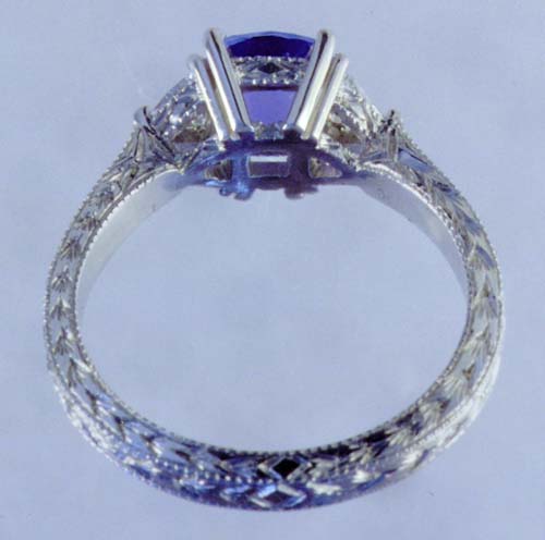 Inside view of engraved platinum ring with tanzanite and diamonds.