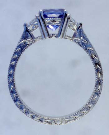 side view of platinum tanzanite and diamond ring.