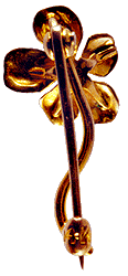 An Art Nouveau flower stickpin.