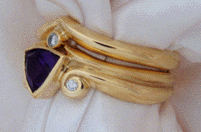 Side view of Amethyst and diamond rings.