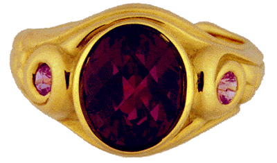 18kt gold ring with honeycomb-cut garnet and pink sapphires.