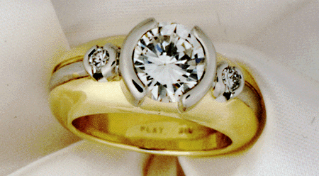 Close-up of bezel-set center diamond.