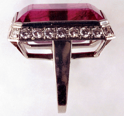 Side view of platinum ring with rubellite tourmaline and diamonds.