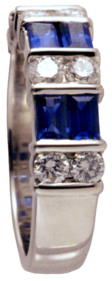 Platinum band with sapphire baguettes and round diamonds.