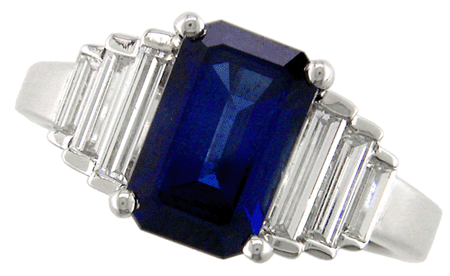 Front view of platinum ring with an emerald-cut sapphire and baguette diamond side stones. (J3868)