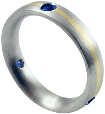 Sapphire wedding band in platinum with 18kt gold accent.