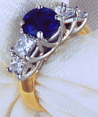 Sapphire and diamond trellis ring of platinum and 18kt gold.