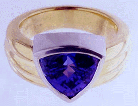 gold and platinum ring with trillium cut tanzanite