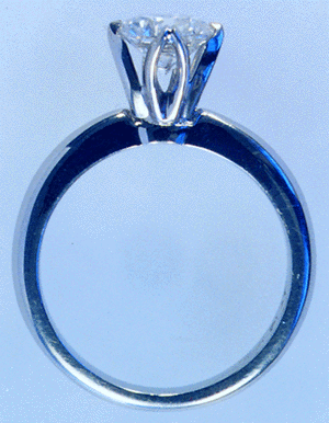 Side-view of platinum and diamond engagement ring.