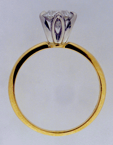 Side-view of 18kt gold & diamond engagement ring.