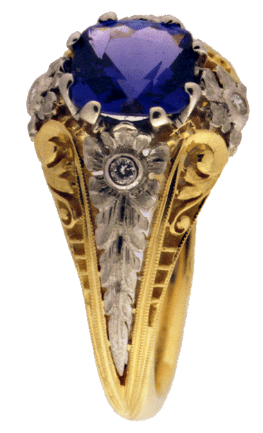 Side view of filigree ring with tanzanite and diamonds.